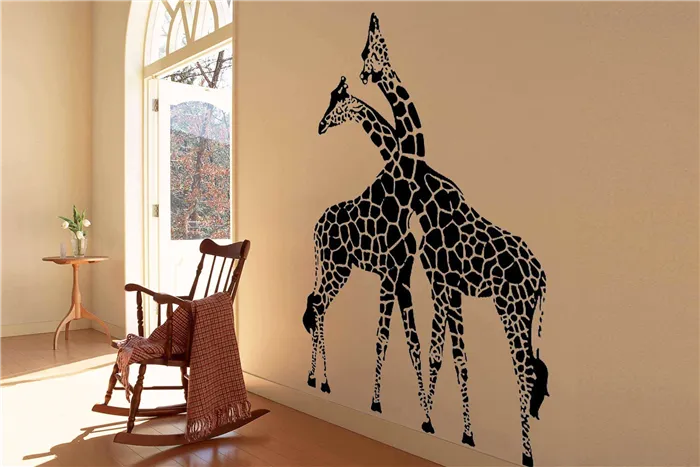 Фотографии жирафов на стене