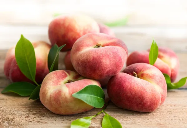Инжирный персик - полезные свойства плоского фрукта для здоровья
